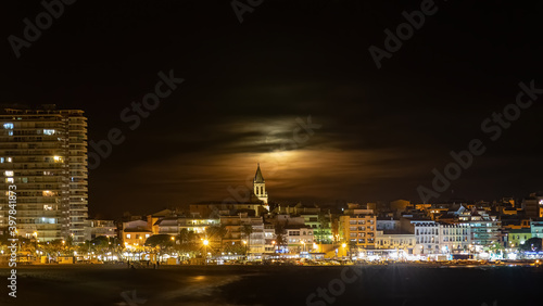 Night shot with full moon behind the clouds,town Palamos in Spanish Costa Brava , Catalonia © Arpad