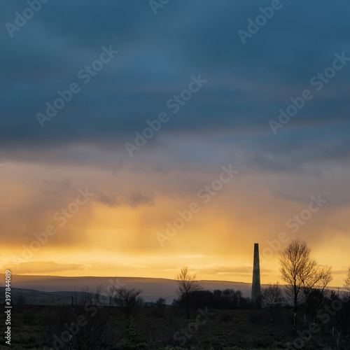 Stublick chimney, Northumberland against dramatic clouds at sunset