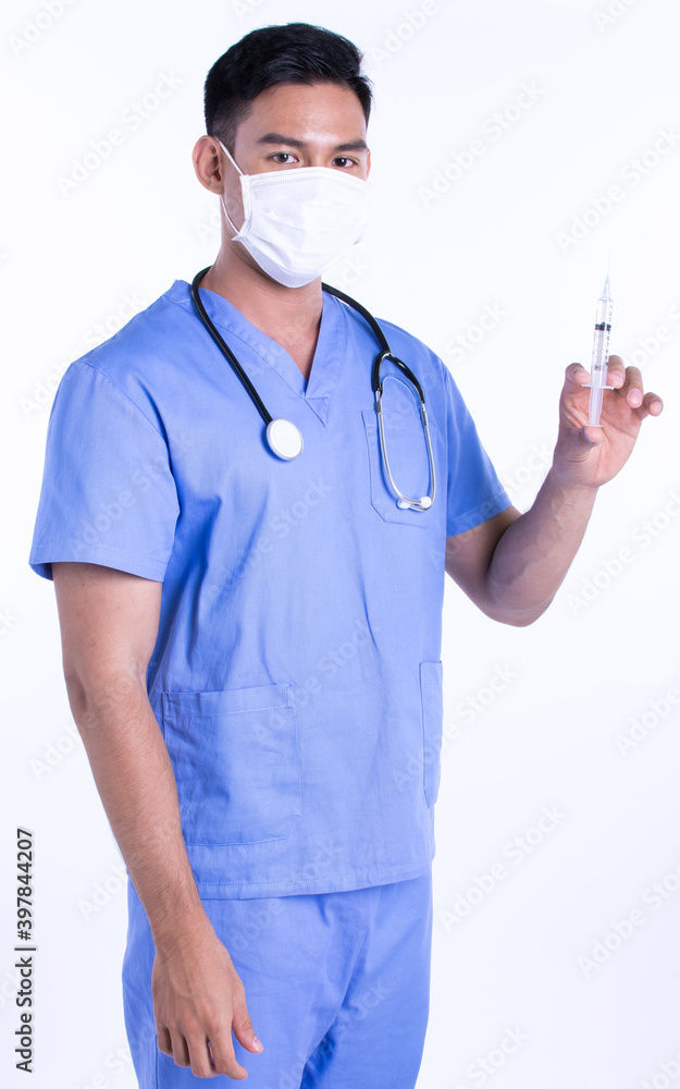Asian male doctor wearing uniform and using syringe for virus protection Asian male doctor wearing uniform and using syringe for virus protection