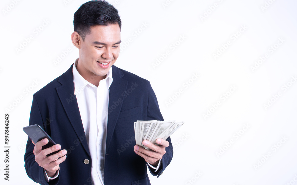 Business man using mobile phone and holding money Business man using mobile phone and holding money