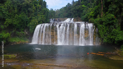 Beautiful waterfall in the rainforest. Tinuy an Falls Waterfall in the tropical mountain jungle. Philippines  Mindanao.