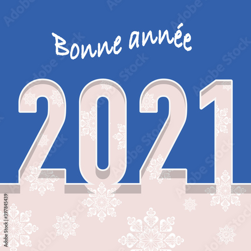 Carte de vœux montrant l’année 2021 découpé sur un fond bleu avec en fond des flocons blancs pour souhaiter la nouvelle année photo