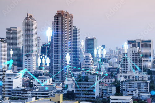 Social media icons hologram over panorama city view of Bangkok, Asia. The concept of people networking and connections. Double exposure. © VideoFlow
