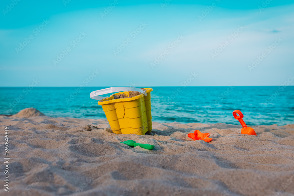 kids toys on tropical sand beach, family vacation concept kids toys on tropical sand beach, family vacation concept
