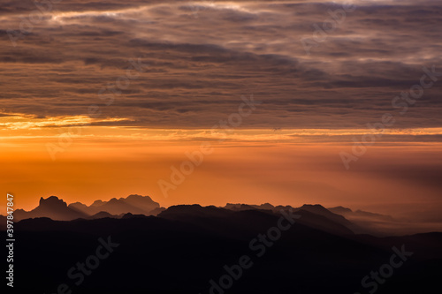 Orange sky at sunset in the mountains