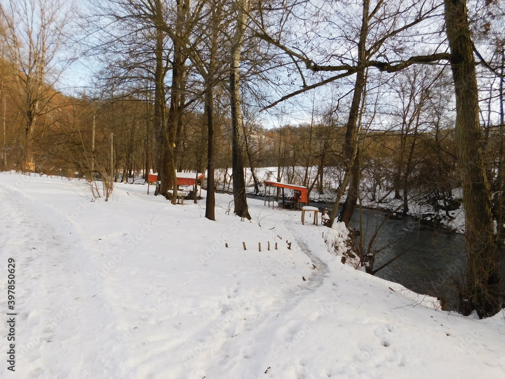 A cult place for retirees on the river Gradac to rest in summer by the river in the winter under the snow A cult place for retirees on the river Gradac to rest in summer by the river in the winter under the snow