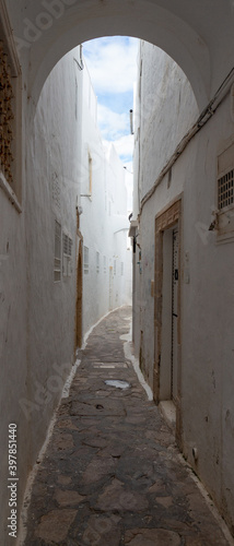 Narrow lane in medina of Hammamet town  Tunisia. Traditional architecture in North Africa.
