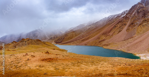 Chandratal or  Lake of the moon is a high altitude lake located at 4300m in Himalayas of Spiti Valley, Himachal Pradesh, India. The name of Lake originated due to its crescent moon like shape. photo