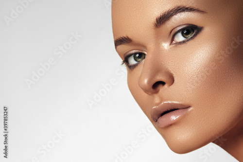 Beauty Woman Face. Beautiful Spa Model with Perfect Fresh Clean Skin. Youth and Skin Care. Tan Beauty Girl photo