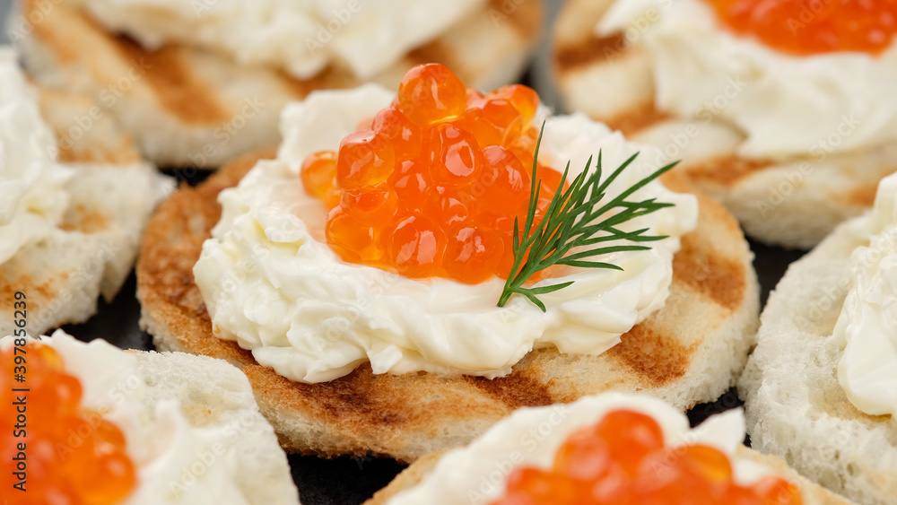red caviar sandwiches with soft cheese close up red caviar sandwiches with soft cheese close up
