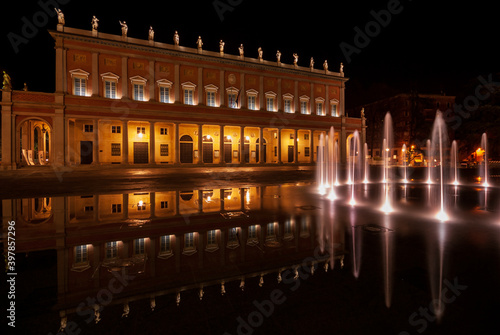 The Romolo Valli Municipal Theater in Reggio Emilia( Italy) with bright modern fountain