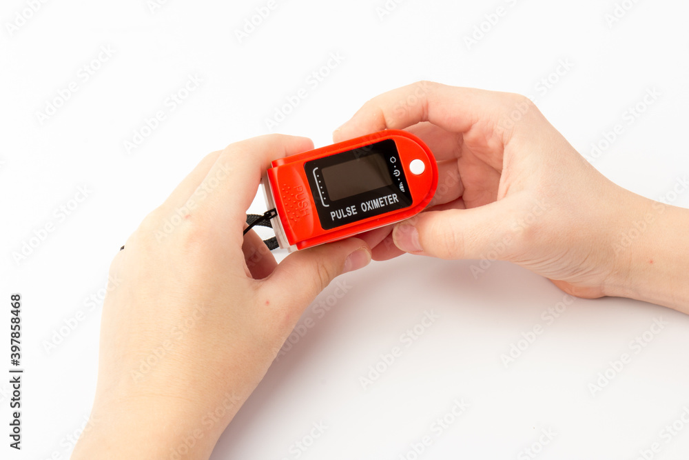 Pulse Oximeter, finger digital device to measure oxygen saturation in blood. Coronavirus symptoms concept. Pulse Oximeter, finger digital device to measure oxygen saturation in blood. Coronavirus symptoms concept.