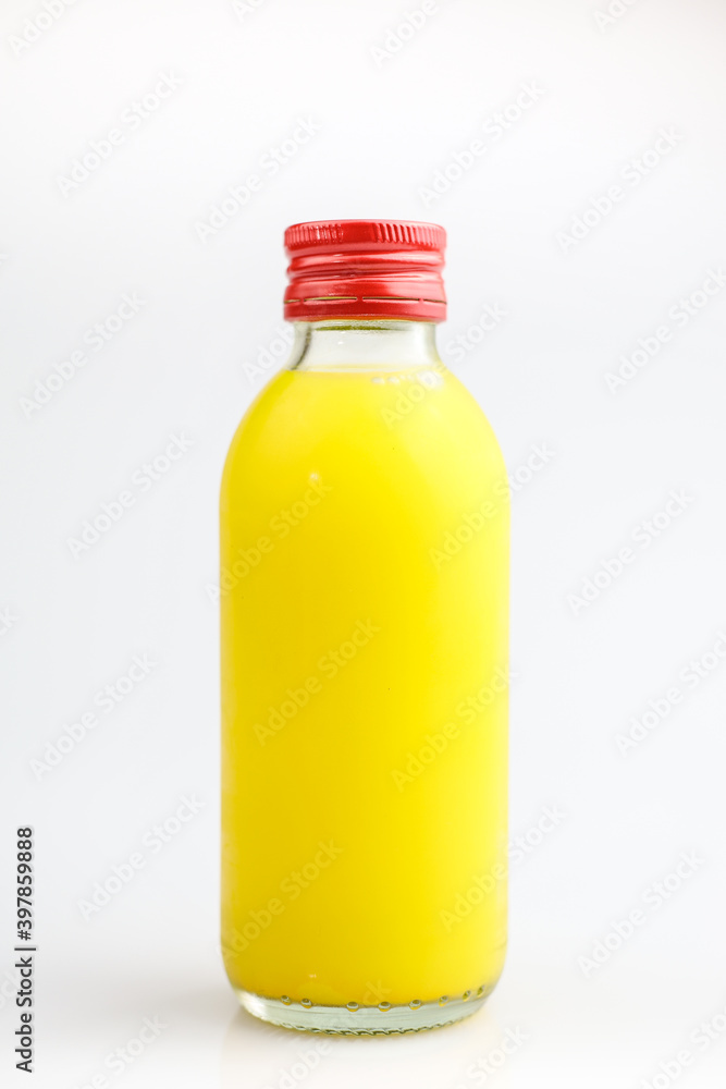 Orange Juice in a Bottle Isolated on White. The concept of beverages, health food and diet. Orange Juice in a Bottle Isolated on White. The concept of beverages, health food and diet.