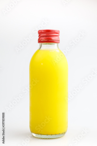 Orange Juice in a Bottle Isolated on White. The concept of beverages, health food and diet.