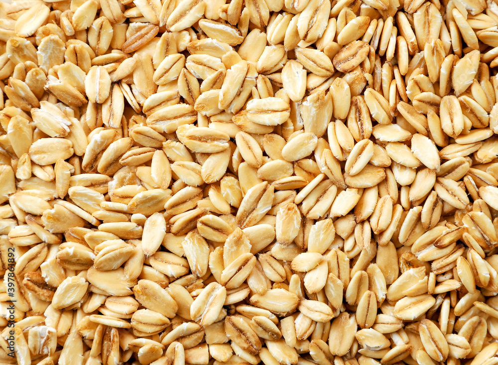 Raw oatmeal close-up, background. The view from top Raw oatmeal close-up, background. The view from top