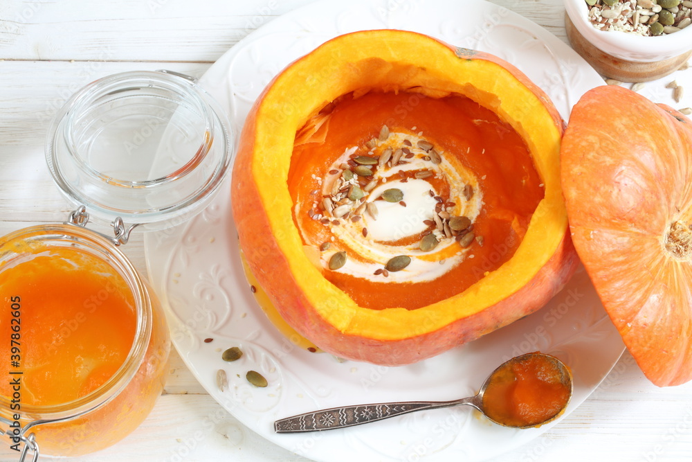 Pumpkin puree soup on white background Pumpkin puree soup on white background