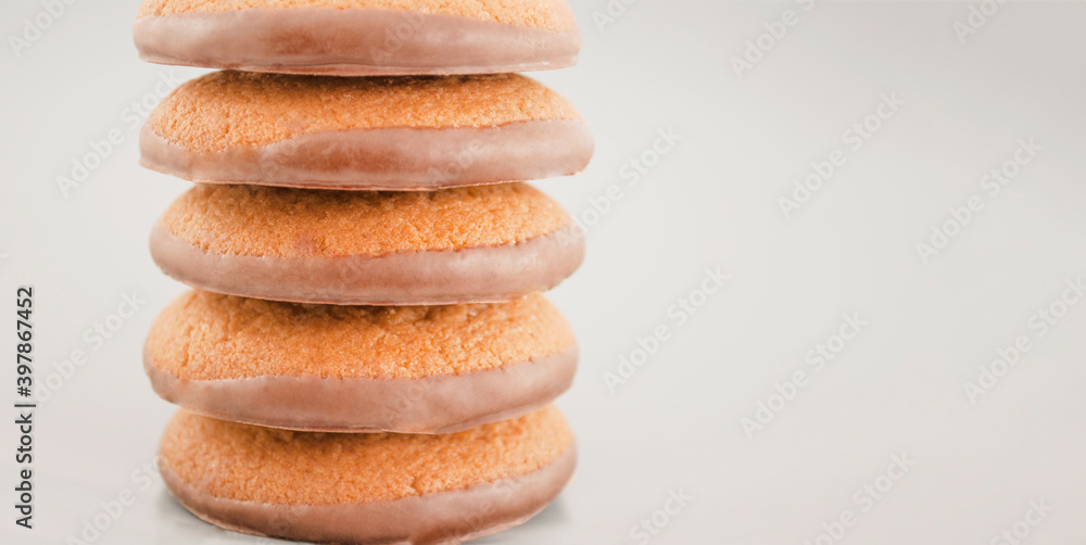 stack of brown cookies with chocolate on a gray background stack of brown cookies with chocolate on a gray background