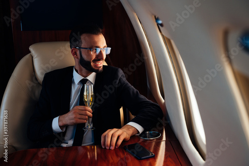 фотографія Businessman flying on his private jet.