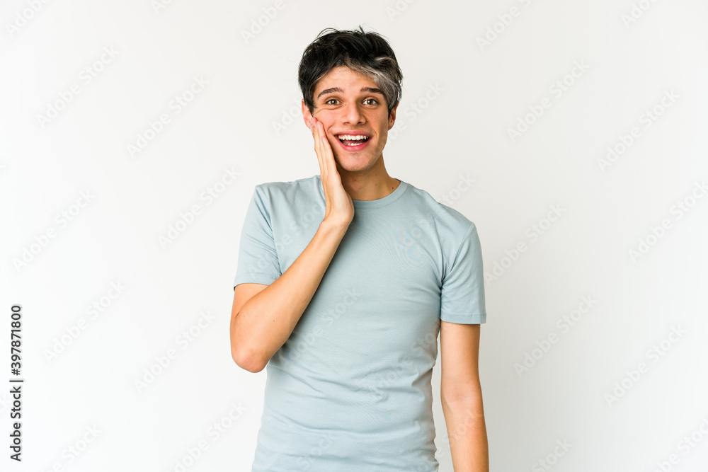 Young skinny hispanic man shouts loud, keeps eyes opened and hands tense. Young skinny hispanic man shouts loud, keeps eyes opened and hands tense.