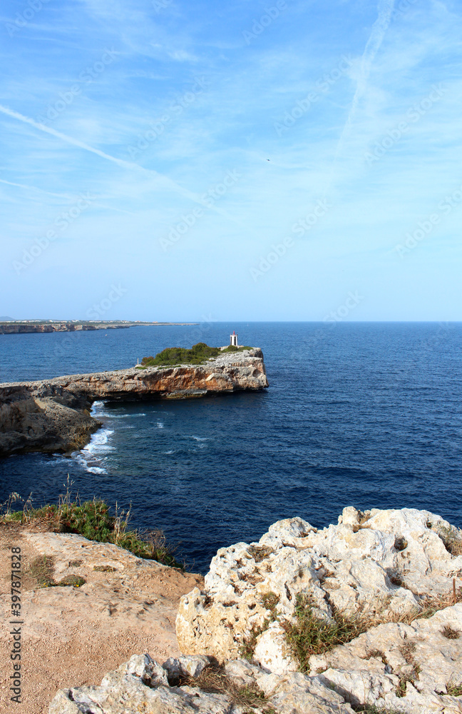 Nice view from the cliff to the cape with the lighthouse. Holidays in Mallorca, Spain.