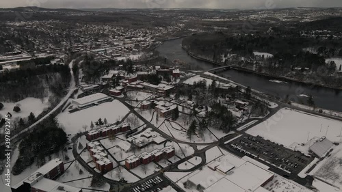 Snow Covered Top View of Lennoxville Borough Near Lake Massawippi In The City Of Sherbrooke, Quebec, Canada. - Aerial Shot photo