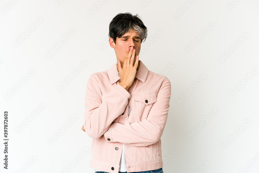 Young skinny hispanic man yawning showing a tired gesture covering mouth with hand. Young skinny hispanic man yawning showing a tired gesture covering mouth with hand.