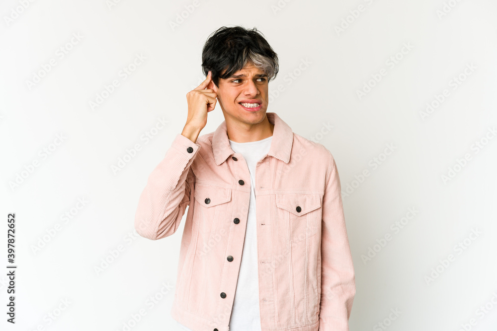Young skinny hispanic man covering ears with hands. Young skinny hispanic man covering ears with hands.