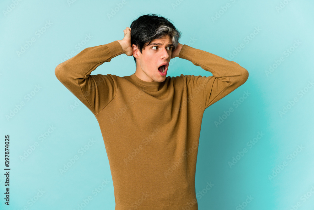 Young caucasian skinny man expressing emotions isolated on blue background Young caucasian skinny man expressing emotions isolated on blue background