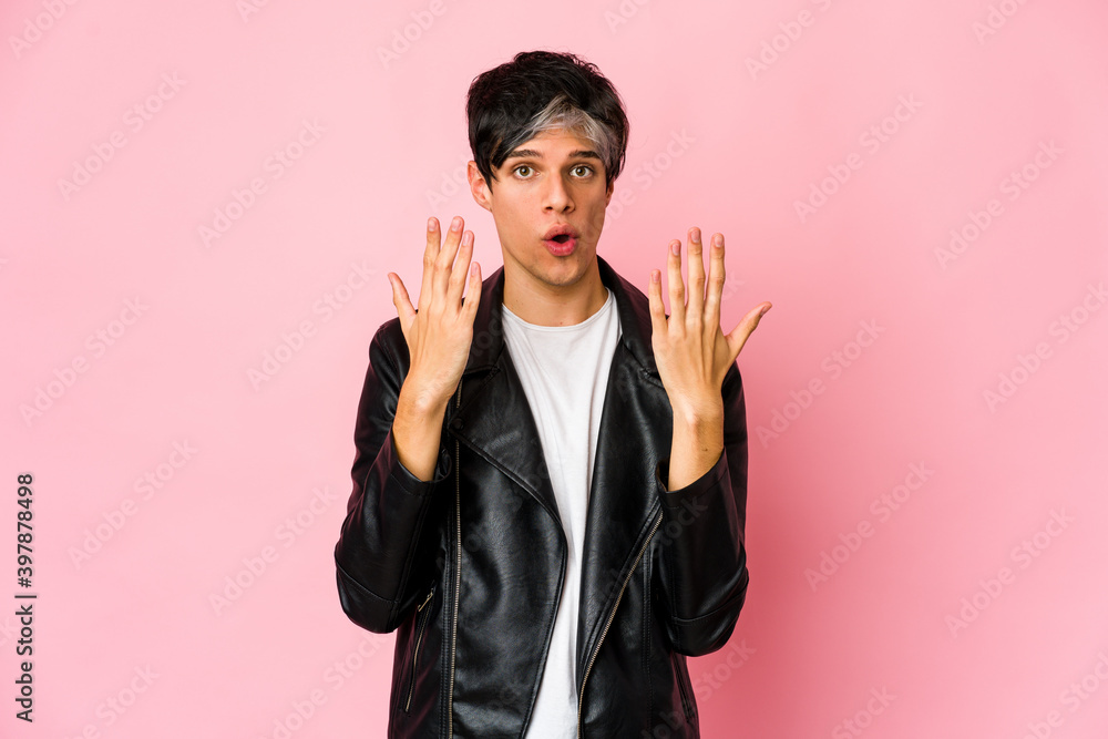 Young skinny hispanic man showing number ten with hands. Young skinny hispanic man showing number ten with hands.