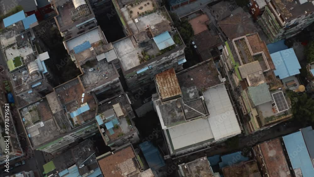 Fly over old rusty roofs of Dongshankou district buildings of Guangzhou city. Urban village in China. Asia Fly over old rusty roofs of Dongshankou district buildings of Guangzhou city. Urban village in China. Asia