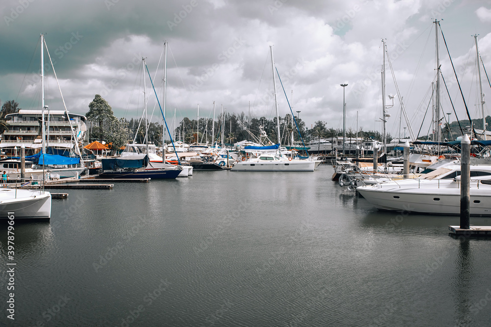 Yachts parking in harbor, Harbor yacht club in the cloudy sky background