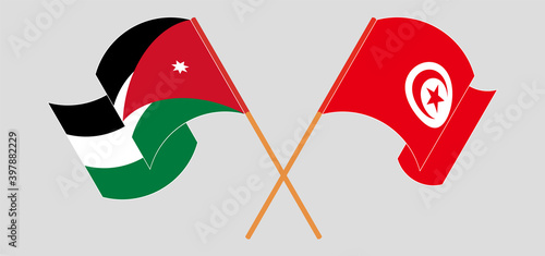 Crossed and waving flags of Jordan and Tunisia