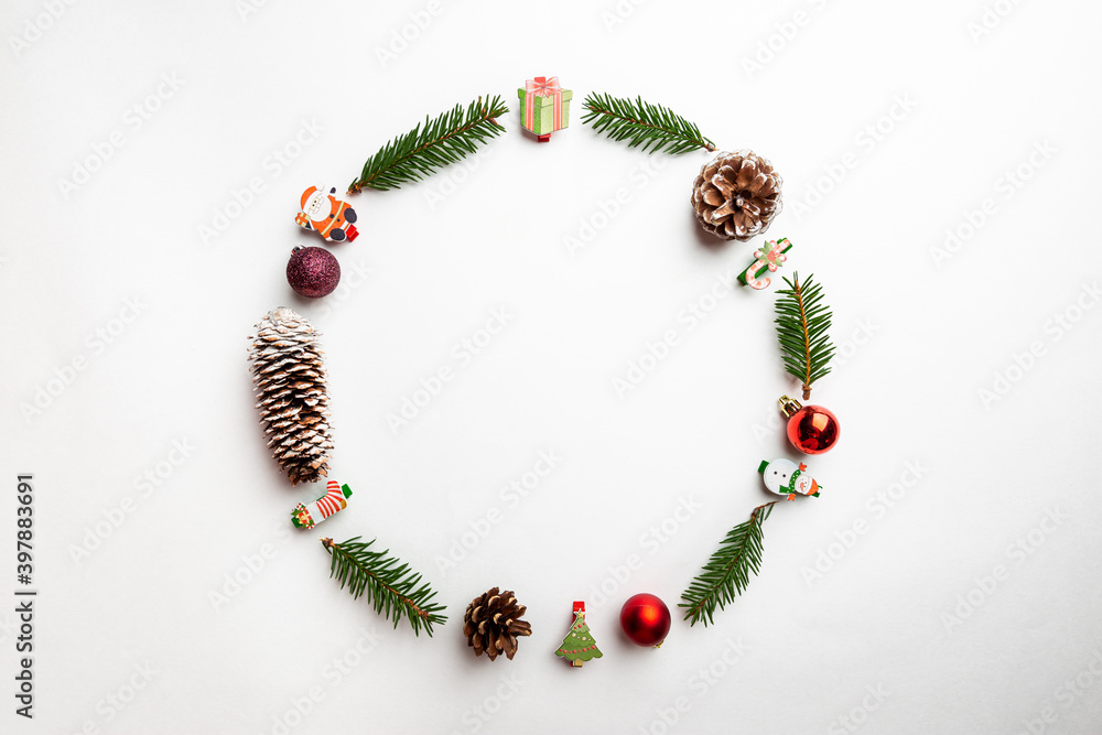 Christmas round frame made of winter decorations on white background. Christmas concept. Flat lay, top view.