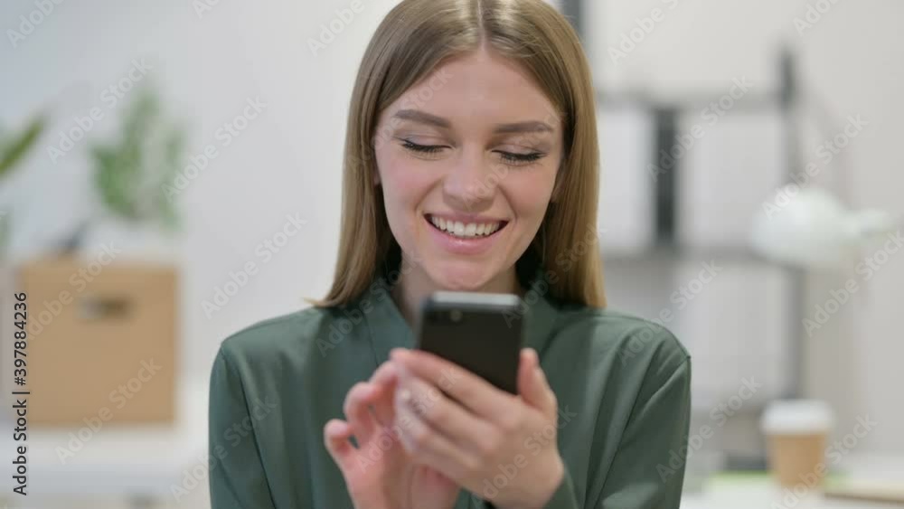 Portrait of Young Woman Celebrating on Smartphone Portrait of Young Woman Celebrating on Smartphone