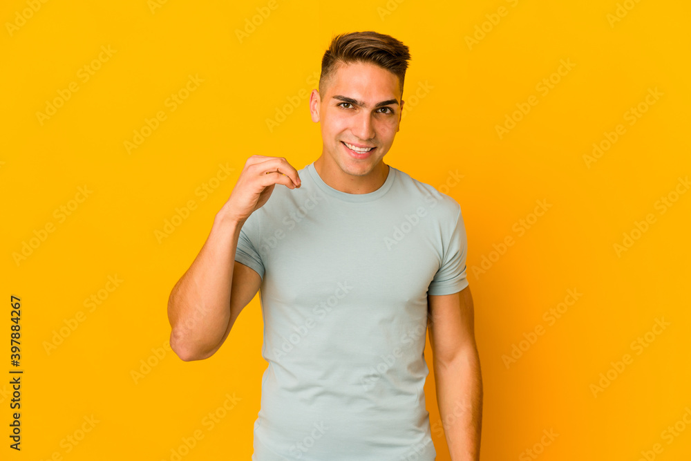 Young handsome caucasian man isolated laughing about something, covering mouth with hands. Young handsome caucasian man isolated laughing about something, covering mouth with hands.