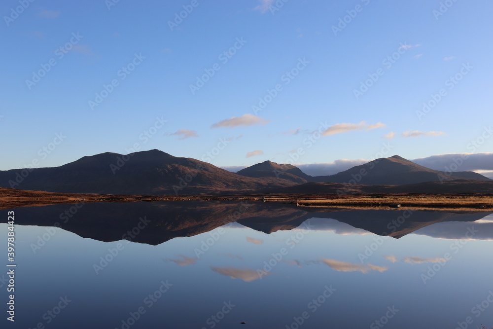 reflection of mountains over lake, south uist, outer hebrides, scotland reflection of mountains over lake, south uist, outer hebrides, scotland