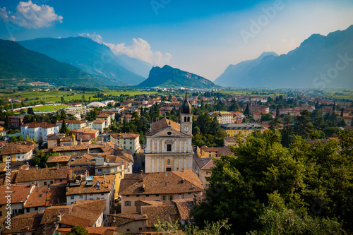 View of the old town of Arco with the Alps and Garda lake in the background