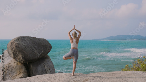 Young Woman Practices Yoga
