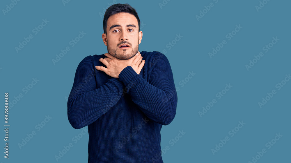 Young handsome man wearing casual clothes shouting and suffocate because painful strangle. health problem. asphyxiate and suicide concept. Young handsome man wearing casual clothes shouting and suffocate because painful strangle. health problem. asphyxiate and suicide concept.