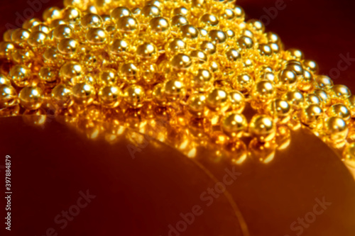 blurry golden glitter christmas abstract background. Concept of beauty and jewelry texture © cenchild