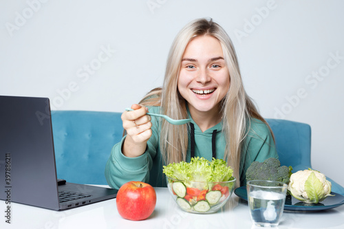 Social media influencers or content maker concept. Woman eating healthy food and expresses emotions. Healthy lifestyle.