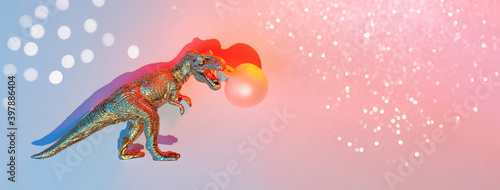 Golden Dinosaur Inflates Bubble Gum  Concept.