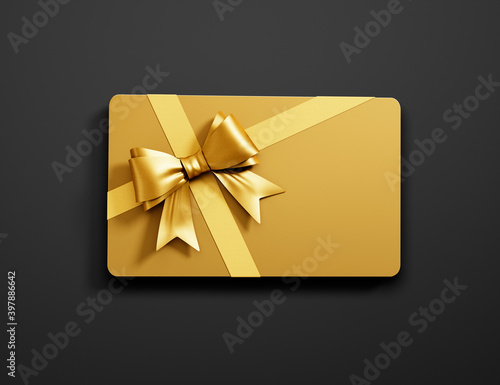 Golden credit or gift card with golden ribbon isolated on dark background - 3D illustration photo