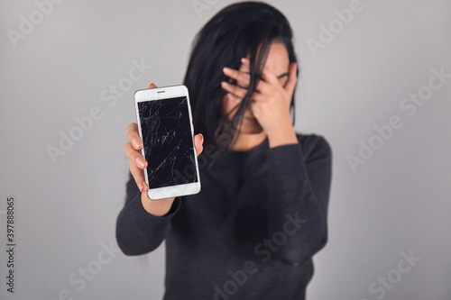 sad woman hand broken phone