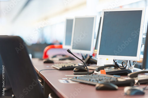 Computers at airport boarding gate photo