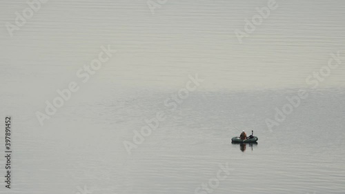 Fishermen on the water catch fish - kind of from afar