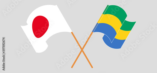 Crossed and waving flags of Japan and Gabon. Vector illustration