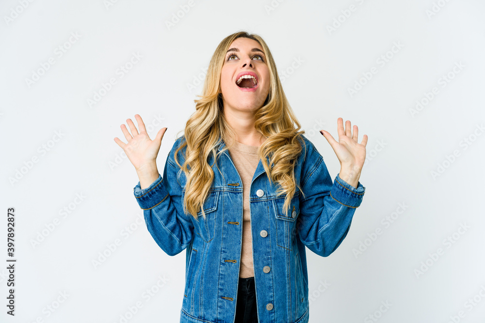 Young caucasian blonde woman screaming to the sky, looking up, frustrated. Young caucasian blonde woman screaming to the sky, looking up, frustrated.