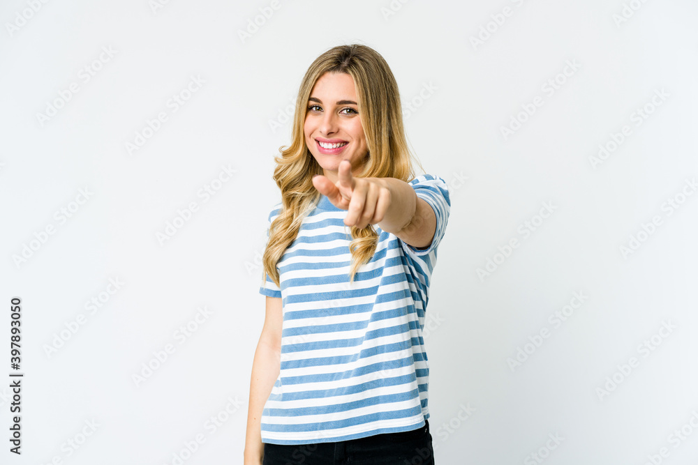 Young caucasian blonde woman pointing to front with fingers. Young caucasian blonde woman pointing to front with fingers.