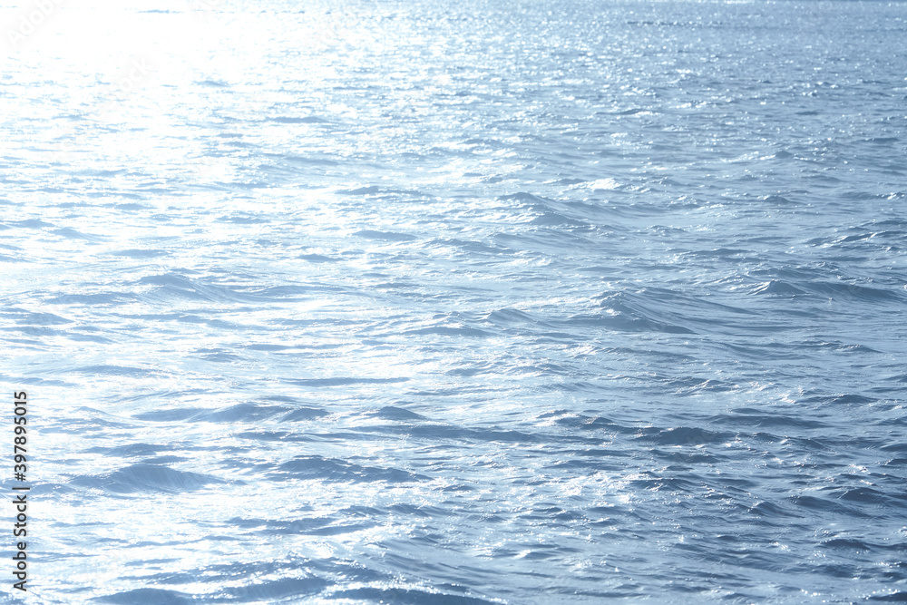 Blue sunlight reflecting in glittering sea. sparkling in water - obrazy, fototapety, plakaty 
